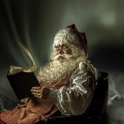 Santa Claus Checking His Book Of Good Boys And Girls