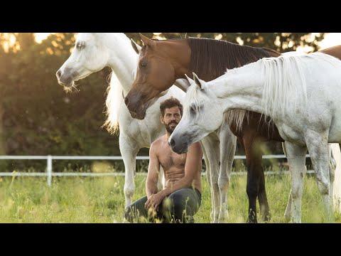 Video Of A Shirt Less Man Riding And Training His Horses