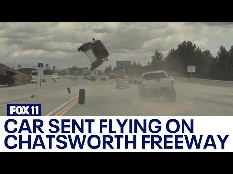 Tire pops off truck, causes car to flip on Chatsworth freeway #Video